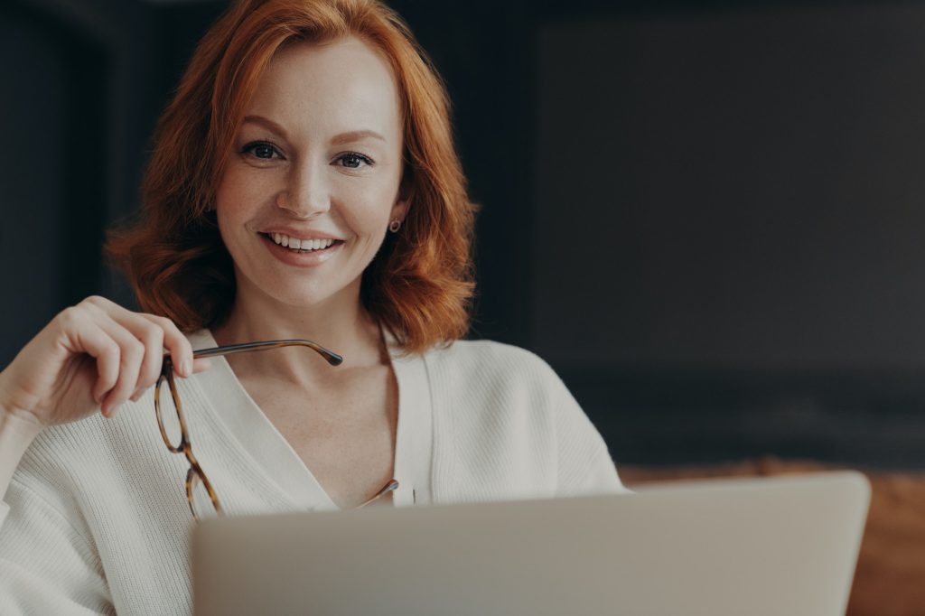 Indoor shot of professional woman copywriter works on creation advertising content